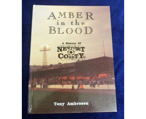 Football book, 'Amber in the Blood, A History of Newport County' by Tony Ambrosen, hard back first edition 1993, signed by au