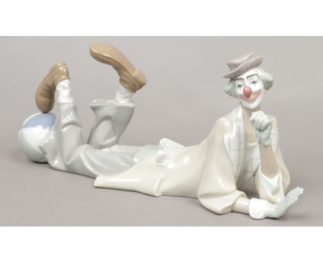 A large Lladro figure of a clown, approximate length 39cm.