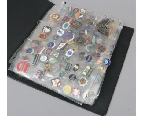 A folder of mostly vintage enamel pin badges including motorcycle, mining, advertising and RAF examples.