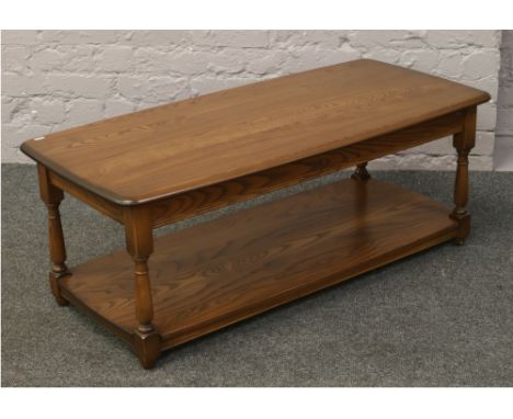 An Ercol Golden Dawn two tier coffee table.