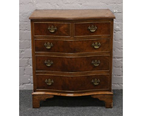 A burr walnut serpentine chest of graduated drawers cross banded in mahogany, raised on bracket feet, 68.5 cm wide, 49cm dept