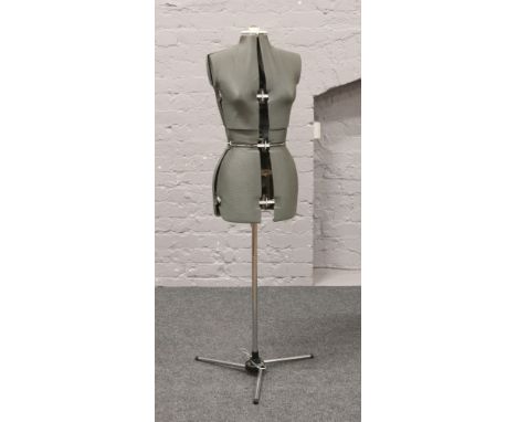 A dressmakers adjustable mannequin with stand.