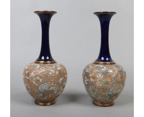 A pair of Doulton Lambeth Slaters patent mantel vases of baluster form with blue and gilt decoration.