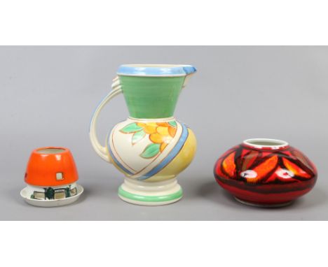 A small group of ceramics to include Poole vase, Crown Ducal jug and George Jones candle holder.