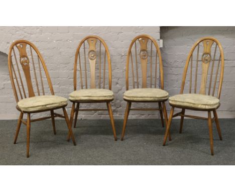 A set of four Ercol Golden Dawn Quaker swan back dining chairs.Condition report intended as a guide only.Good condition