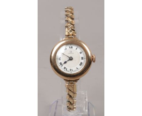 A 9ct gold cased bracelet watch (bracelet gold plated) with enamel dial having Roman numeral markers, movement stamped 704174