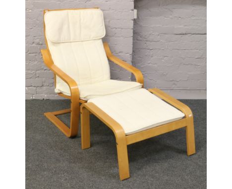 A modern Ikea easy chair with footstool.