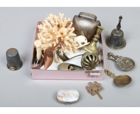 A box of collectables including a coral specimen, Dartmouth Pixie caddy spoons and Royal crest cap badge etc.