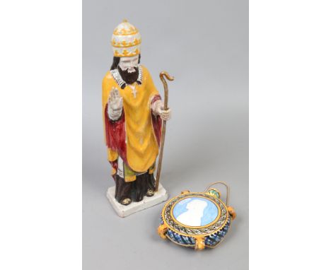 A continental Faience figure of a Saint height 36cm, along with a similar Italian flask (some damage).