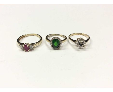 Three 9ct gold gem set dress rings to include synthetic ruby and diamond cluster ring, size O½, synthetic green oval stone wi