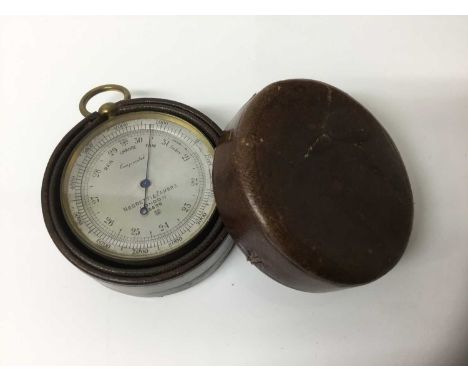 Early 20th century pocket barometer by Negretti &amp; Zambra, the silvered dial numbered 3899, 5cm diameter, fitted leather c