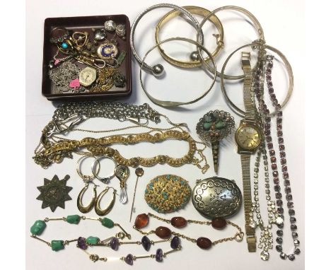 Group of costume jewellery to include bangles, stick pins, brooches and a ladies Tissot wristwatch