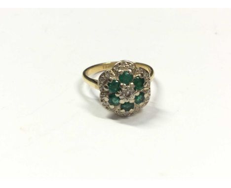 18ct gold emerald and diamond cluster ring. Size K½Condition report: Shank stamped ‘18ct’ Weight 4.4 grams 