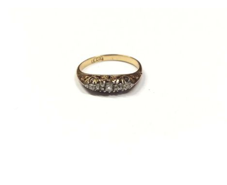 Late Victorian diamond five stone ring with five graduated old cut diamonds in carved gold claw setting on 18ct gold shank. R