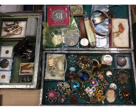 Two pewter jewellery boxes containing vintage brooches, silver identity plaque on leather bracelet, gold plated bangle, vario