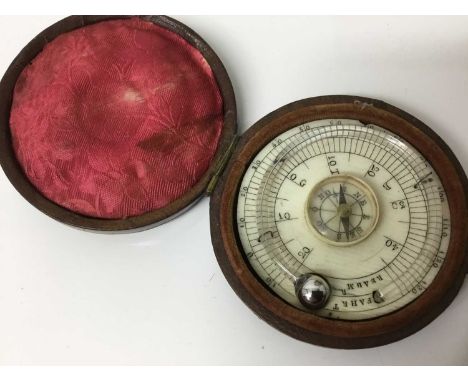 Early 19th century ivory pocket thermometer / compass, of circular form with engraved dial, 6cm diameter, in leather fitted c