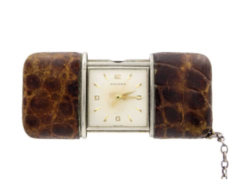 MOVADO - An Art Deco travelling purse watch. The signed silvered square dial with Arabic quarter numerals and arrow hour mark
