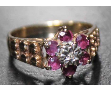 20TH CENTURY RUBY AND DIAMOND CLUSTER RING
with a central brilliant cut diamond, surrounded by a row of rubies, hallmarked ni