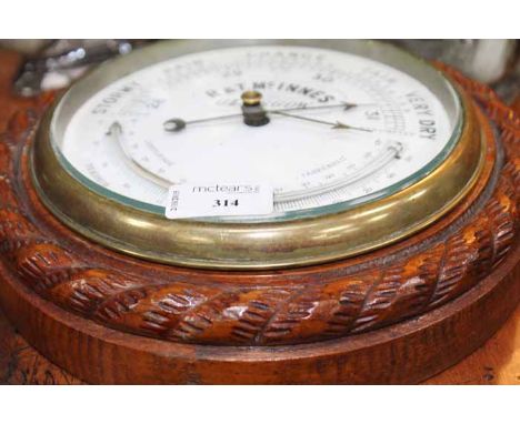 OAK CIRCULAR ANEROID BAROMETER
by R & T McInnes of Glasgow