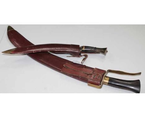 EARLY 20TH CENTURY KUKRI
steel blade, brass edged handle, with scabbard, 41cm long; together with a larger curved knife with 