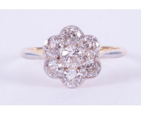 An antique 18ct yellow gold &amp; platinum flower cluster ring set with approx. 1.27 carats total weight of old round cut dia