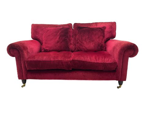 Laura Ashley - two seat sofa upholstered in red velvet fabric, turned mahogany feet with brass castorsDimensions: Height:&nbs