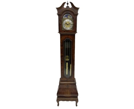 A late 20th century �Grandmother� clock in a figured mahogany veneered case with a break-arch hood and turned central finial,