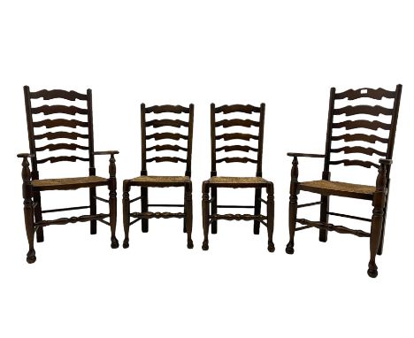 Set of four quality elm ladder back dining chairs, comprising two carver armchairs and two side chairs, with rush seats