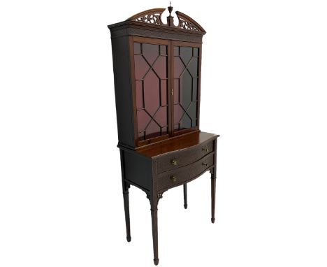 Edwardian mahogany tall and narrow display cabinet with scroll pierced broken arch pediment over two astragal glazed doors on