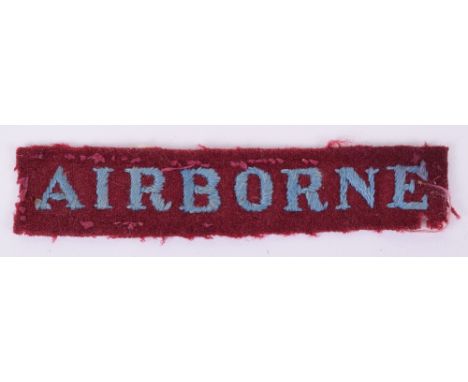 Scarce Early WW2 Embroidered Airborne Title, being the light blue embroidered lettering on straight rectangular maroon backin