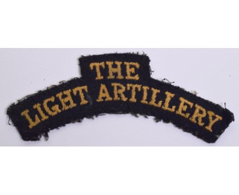 Scarce WW2 The Light Artillery Cloth Shoulder Title, embroidered yellow lettering on black backing cloth. Good uniform remove