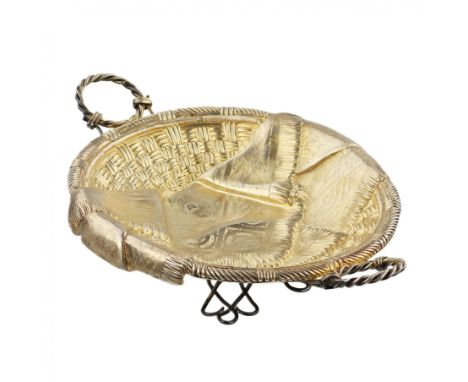 An oval silver plate imitating relief bast weaving and basket weaving, made in the workshops of Andrey Mikhailovich Postnikov