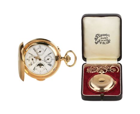 An exquisite antique gold pocket watch with a quarter repeater and chain, housed in its original leather case, crafted by the