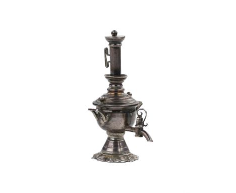 Miniature silver samovar is an example of Russian jewelry art of the early 20th century. Its refined proportions, relief base