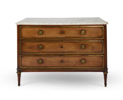 A DIRECTOIRE BRASS MOUNTED MAHOGANY COMMODE  BY CHARLES SAUNIER, LATE 18TH CENTURY  With a white mottled marble top above thr