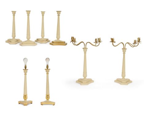 A GROUP OF CREAM PAINTED OUTDOOR LIGHTING, MODERN  Comprising: A set of eight candlesticks, four with brass twin light branch