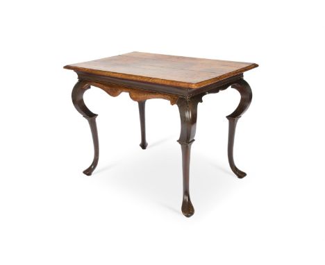 AN ANGLO-DUTCH OAK AND GRAINED FRUITWOOD CENTRE TABLE  EARLY 18TH CENTURY   The rounded rectangular top above a sinuous cushi