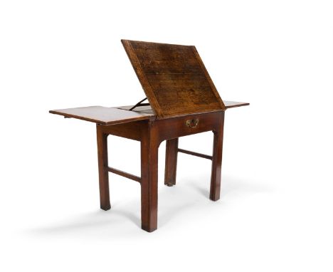 A GEORGE III PROVINCIAL OAK DRAUGHTSMAN'S TABLE  LATE 18TH CENTURY  The cleated and ratchetted top with drop leaves above a d