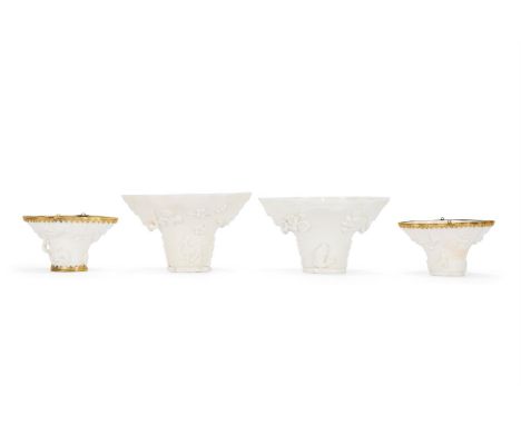 A PAIR OF CHINESE DEHUA LIBATION CUPS  17TH/18TH CENTURY   White porcelain modelled in the form of a rhino horn  14cm diamete