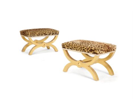 A PAIR OF GILTWOOD X-FRAME STOOLS OF EMPIRE STYLE  LATE 20TH CENTURY,  BY NICK HODGES FOR PHILIP ASTLEY-JONES  With leopard p