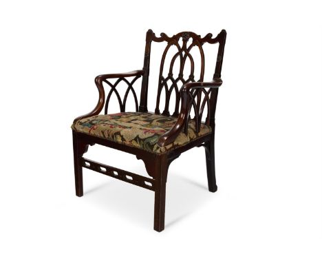 A GEORGE III MAHOGANY 'GOTHICK' OPEN ARMCHAIR  CIRCA 1760 AND LATER  With a shaped top rail and pierced arcaded splat above a