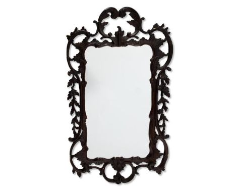 A GEORGE II SIMULATED MAHOGANY FRAMED MIRROR MID 18TH CENTURY  With a carved and pierced surround of foliage and C-scrolls an
