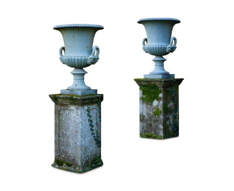A PAIR OF HANDYSIDE CAST IRON PLANTERS LATE 19TH CENTURY    Formerly with applied floral mounts, grey painted planters 78cm h