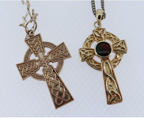 TWO SIMILAR CELTIC GOLD CROSS PENDANTS comprising 9ct example on chain together with 14K example on plated chain, 7.5gms over