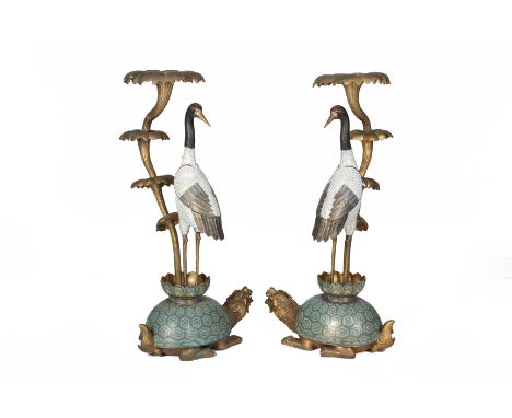 A PAIR OF LARGE CLOISONNE ENAMEL MODELS OF CRANES Late 20th Century, modelled standing aside foliage on a mythical dragon tor