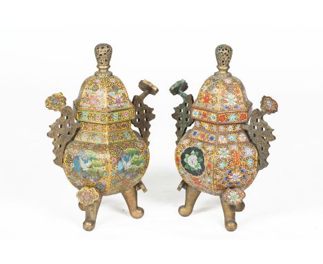 TWO SIMILAR CLOISONNE ENAMEL HEXAGONAL TRIPOD CENSERS
Late 20th Century, with ruyi shaped handles and supports and stylised f
