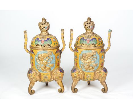 A PAIR OF LARGE CLOISONNE ENAMEL CENSERS AND COVERS
Late 20th Century, of cylindrical form on elephant supports and decorated