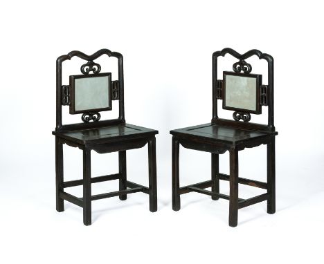 A PAIR OF MARBLE INSET HARDWOOD SIDE CHAIRS
The shaped top rail above a square inset marble panel 

All items sold as seen
10