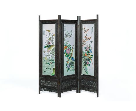 A CHINESE THREE FOLD PORCELAIN INSET SCREEN
Decorated with cranes, pheasants and other birds, peonies, lotus and flowering fo