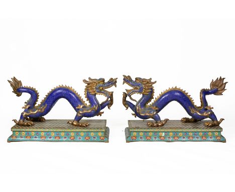 A PAIR OF LARGE CLOISONNE ENAMEL MODELS OF DRAGONS Late 20th Century, on rectangular plinth base (dragons slightly wobbly at 